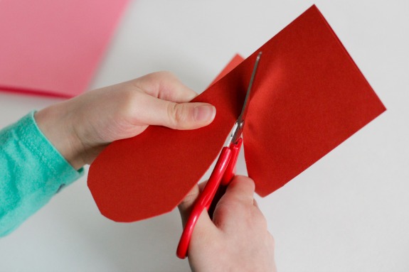 Cutting-Paper-Hearts-@makeandtakes.com_